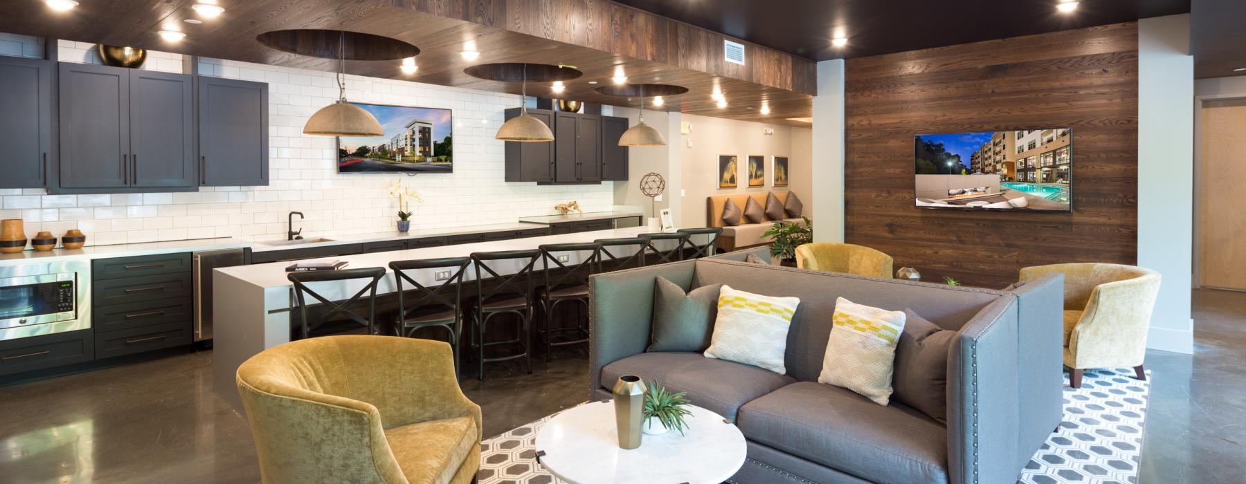 a room with a bar and chairs