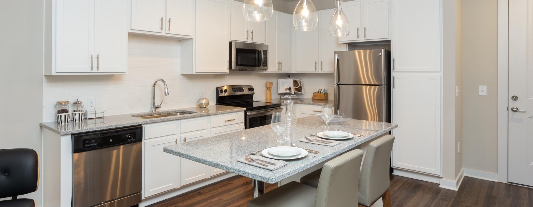a kitchen with white cabinets